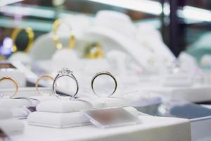 Jewelry diamond rings and necklaces show in luxury retail store window display photo