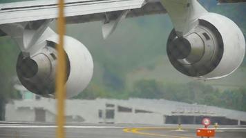 Close up engines widebody airplane at start runway before departure from Phuket airport video