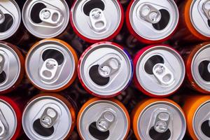 Empty aluminium drink cans recycling background concept, top view closeup photo
