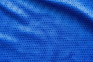 Blue color fabric sport clothing football jersey with air mesh texture background photo