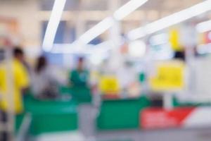 Blur cashier checkout counter in the supermarket photo