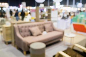 Abstract blur sofa in furniture showroom store interior with bokeh light background for montage product display photo