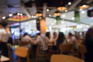 People in restaurant cafe interior with bokeh light blurred customer abstract background photo