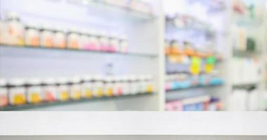 Pharmacy drugstore counter with medicine and vitamin supplement on shelves blur abstract background for montage healthcare product display photo