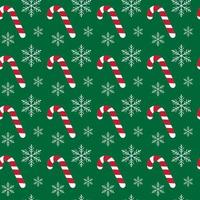 Christmas seamless pattern with candy canes and snowflakes on green background. For wrapping paper, fabric print, greeting cards design vector