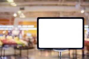 Blank price board sign display in Supermarket with fresh food abstract blurred background with bokeh light photo