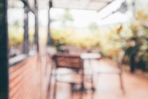 Cafe coffee shop interior abstract blur defocused with bokeh light background photo