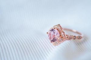 Jewelry luxury pink gold sapphire gemstone ring background photo