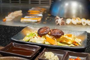 Stir fried Shiitake mushroom with vegetable dish in teppanyaki restaurant photo