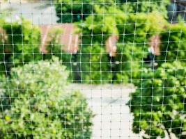 plastic net with garden background photo