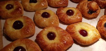 Assorted fresh baked sweet puff pastry stuffed with fruit and jelly and danish chocolate fill pastry photo