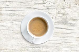 coffee mug, top view, isolated on white wooden table photo