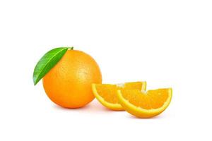 whole oranges, oranges that have been cut into small pieces with green leaves isolated on a white background photo