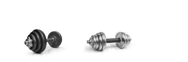 Metal dumbbells on a white background. Gym, fitness and sports equipment symbols. text input area photo