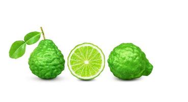 kaffir lime fruit with stems and leaves isolated on white background and space for text input photo