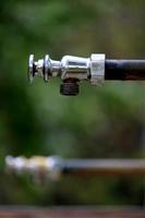 Iron Water Tap in Garden, Almatti, Karnataka. photo