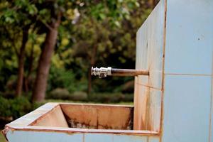 Iron Water Tap in Garden, Almatti, Karnataka. photo