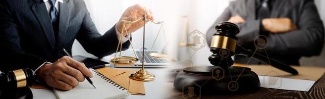 Business and lawyers discussing contract papers with brass scale on desk in office. Law, legal services, advice, justice and law concept picture with film grain effect photo