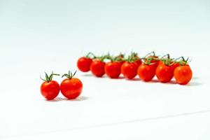 tometoes isolate on white background. bunch the red tometos isolated in white background its fresh nutritious and citrious photo