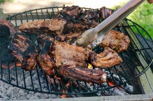 Spare ribs Cooking On Grill, Outdoor Beef and Pork BBQ photo