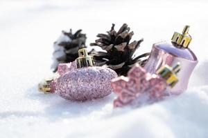 Christmas - Baubles Decorated, Pink xmas balls, Pine And Snowflakes In Snowing Background photo