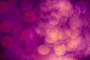 Dark purple Festive Christmas Beautiful abstract Background with bokeh lights. Holiday Texture with copy space. Can be used as Wallpaper, filling for a website, defocused photo