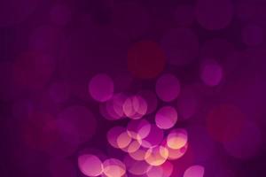 Dark purple Festive Christmas Beautiful abstract Background with bokeh lights. Holiday Texture with copy space. Can be used as Wallpaper, filling for a website, defocused photo