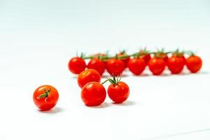 tometoes isolate on white background. bunch the red tometos isolated in white background its fresh nutritious and citrious photo