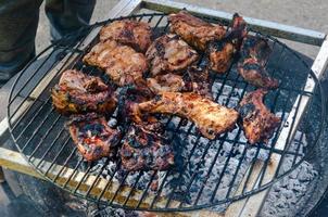 Spare ribs Cooking On Grill, Outdoor Beef and Pork BBQ photo