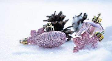 Christmas - Baubles Decorated, Pink xmas balls, Pine And Snowflakes In Snowing Background photo