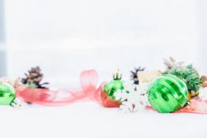 Christmas of  winter - Christmas balls with ribbon on snow, Winter holidays concept. Christmas red balls, golden balls, pine And Snowflakes decorations In Snow Background photo