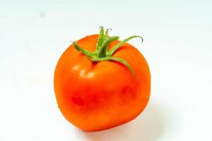 tometoes isolate on white background. bunch the red tometos isolated in white background its fresh nutritious and citrious photo