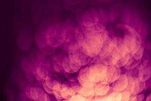 Dark purple Festive Christmas Beautiful abstract Background with bokeh lights. Holiday Texture with copy space. Can be used as Wallpaper, filling for a website, defocused photo