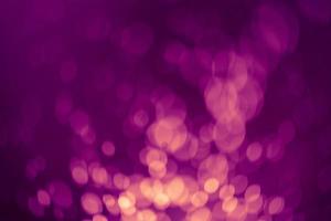 Dark purple Festive Christmas Beautiful abstract Background with bokeh lights. Holiday Texture with copy space. Can be used as Wallpaper, filling for a website, defocused photo