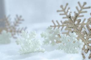 Christmas of  winter - Christmas balls with ribbon on snow, Winter holidays concept. Christmas red balls, golden balls, pine And Snowflakes decorations In Snow Background photo