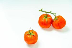 tometoes isolate on white background. bunch the red tometos isolated in white background its fresh nutritious and citrious photo
