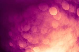 Dark purple Festive Christmas Beautiful abstract Background with bokeh lights. Holiday Texture with copy space. Can be used as Wallpaper, filling for a website, defocused photo