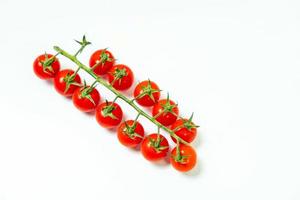 tometoes isolate on white background. bunch the red tometos isolated in white background its fresh nutritious and citrious photo