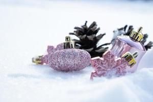 Christmas - Baubles Decorated, Pink xmas balls, Pine And Snowflakes In Snowing Background photo