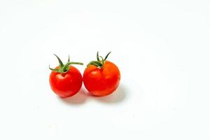 tometoes isolate on white background. bunch the red tometos isolated in white background its fresh nutritious and citrious photo