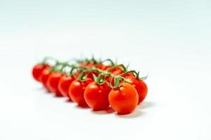 tometoes isolate on white background. bunch the red tometos isolated in white background its fresh nutritious and citrious photo