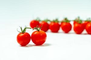 tometoes isolate on white background. bunch the red tometos isolated in white background its fresh nutritious and citrious photo