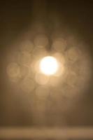 Texture, pattern, background. light crystal chandelier with blurred focus photo