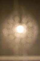 Texture, pattern, background. light crystal chandelier with blurred focus photo