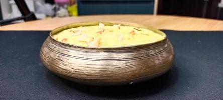 Rice Kheer or Firni or Chawal ki Khir is a pudding from Indian subcontinent, made by boiling milk ,sugar and Rice. Served in a bowl photo