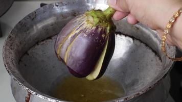 Whole fresh eggplant or aubergine bringal,purple eggplant aubergine steamed cooked with spice and herb for frozen and preserve for later cooking photo