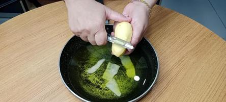 Potato Peels in Oil for making Process of Potato Chips, Aalu Chips photo