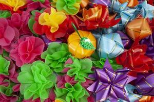 Fold the colorful mulberry paper or ribbon and put the coin inside for donate in buddhism of Thailand. photo