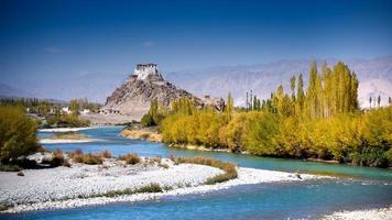 Stakna monastery with view of Himalayan mountians photo