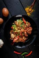 Stir Fried Soft Shell Crab Curry Powder with Sweet Chili and Egg It is a famous seafood in Thailand. photo